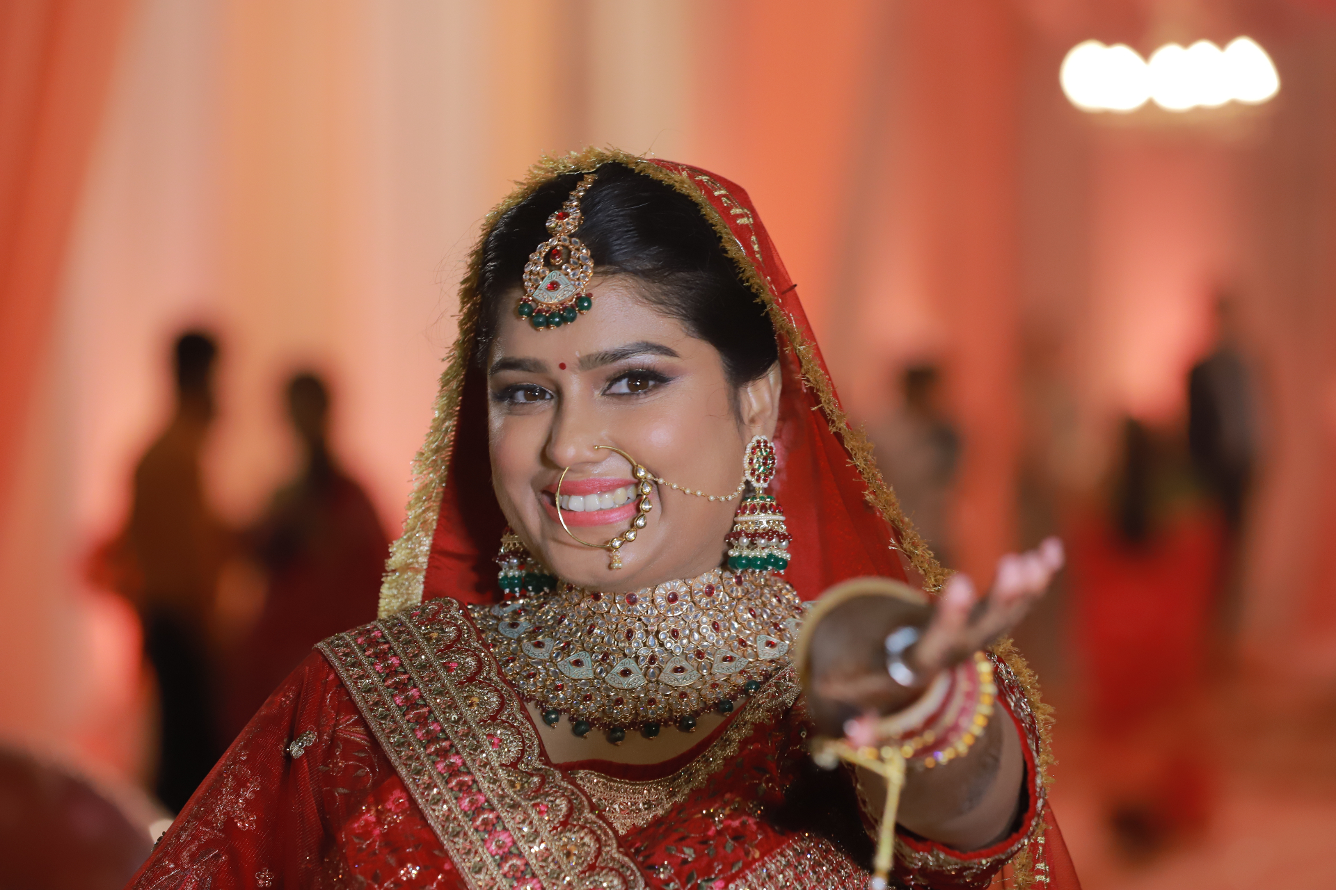 Smiling bride in traditional red wedding attire