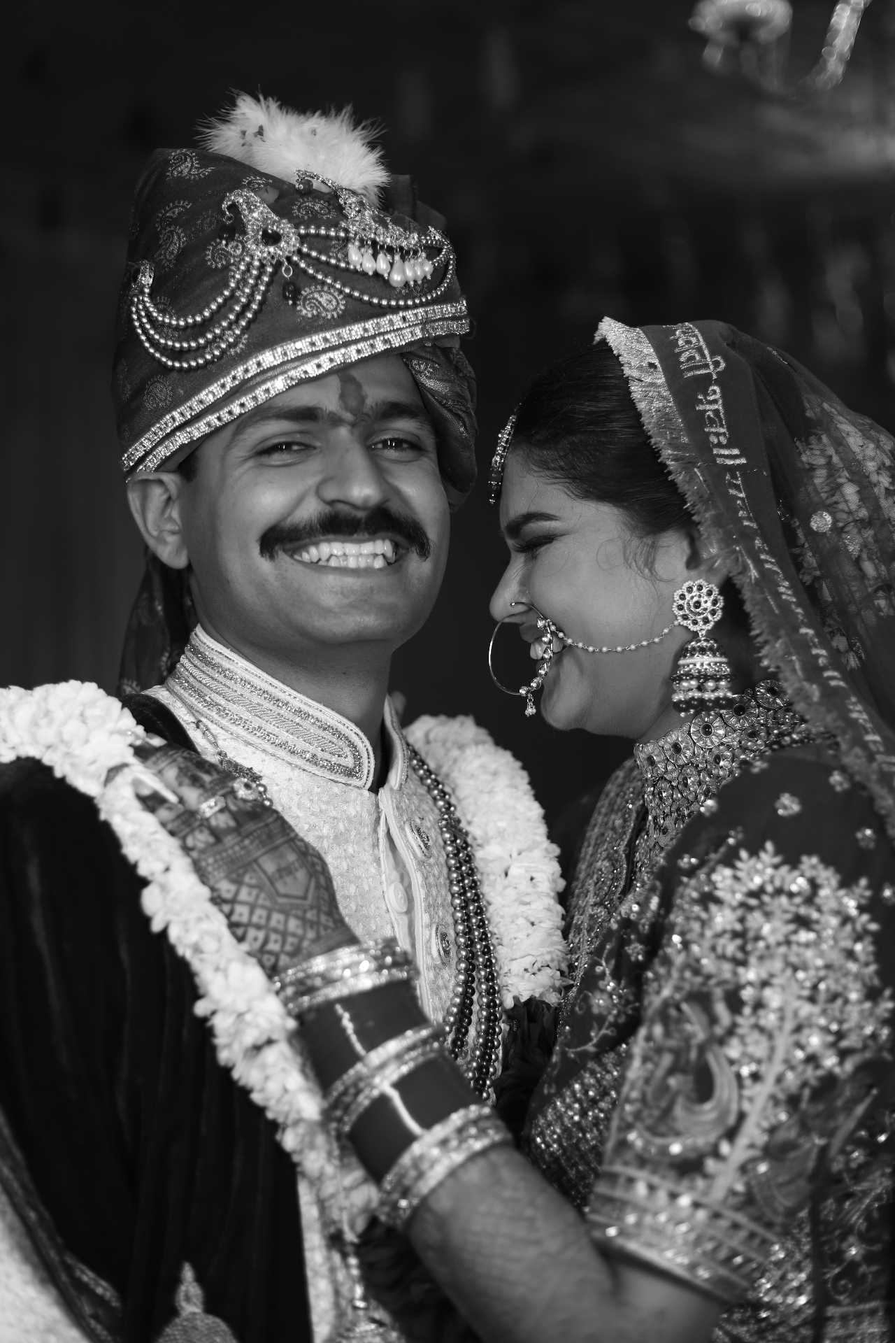 Black and white candid portrait of a newlywed couple