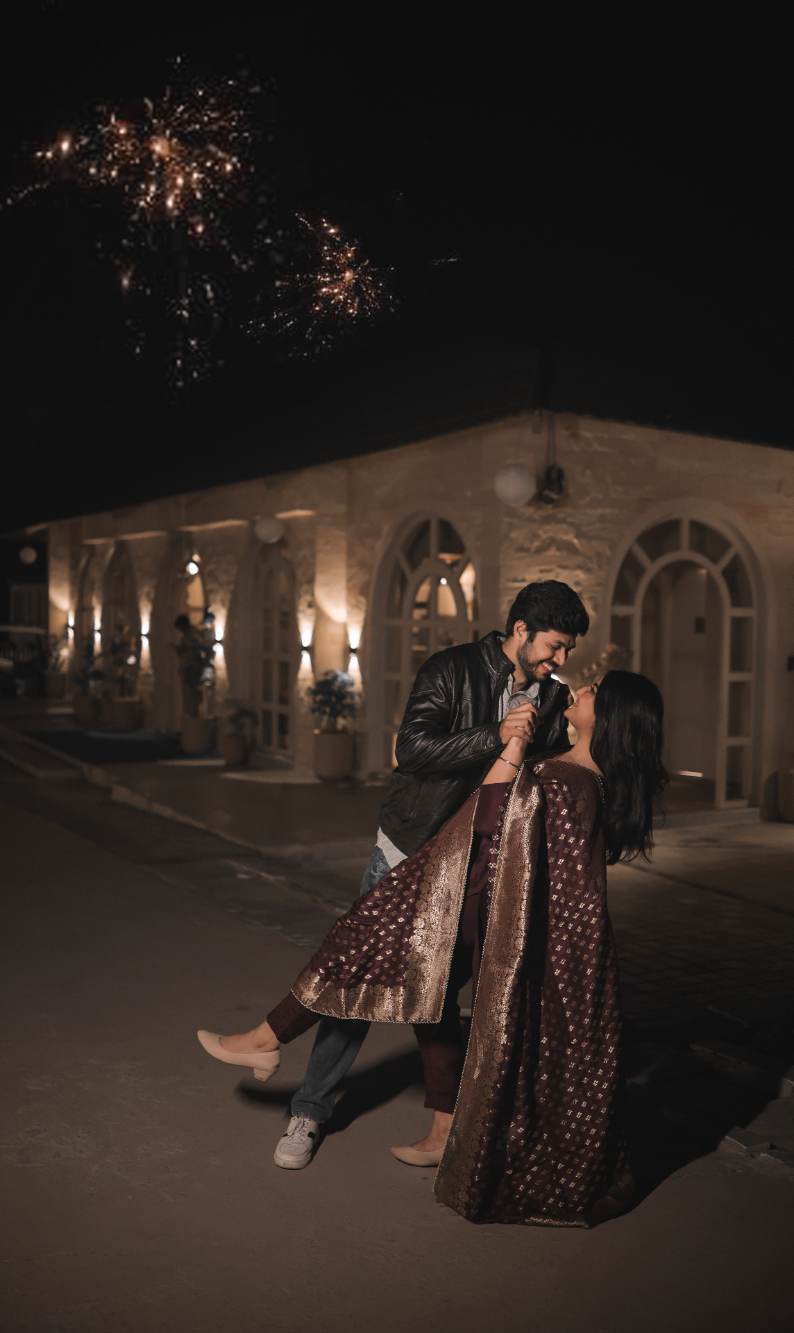 Couple dancing together under the night sky